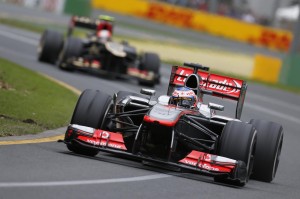 Jenson Button leads Romain Grosjean of Lotus F1